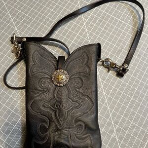 Cowboy boot shaped crossbody by Larry Mahan (signed)